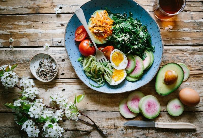 Healthy meal bowl with vegetables, eggs and avocado