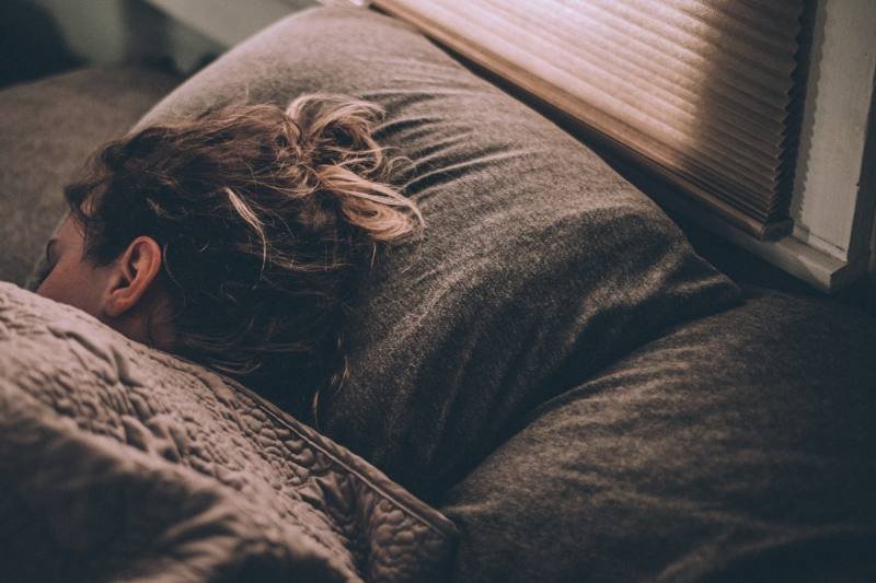 Person sleeping comfortably in bed